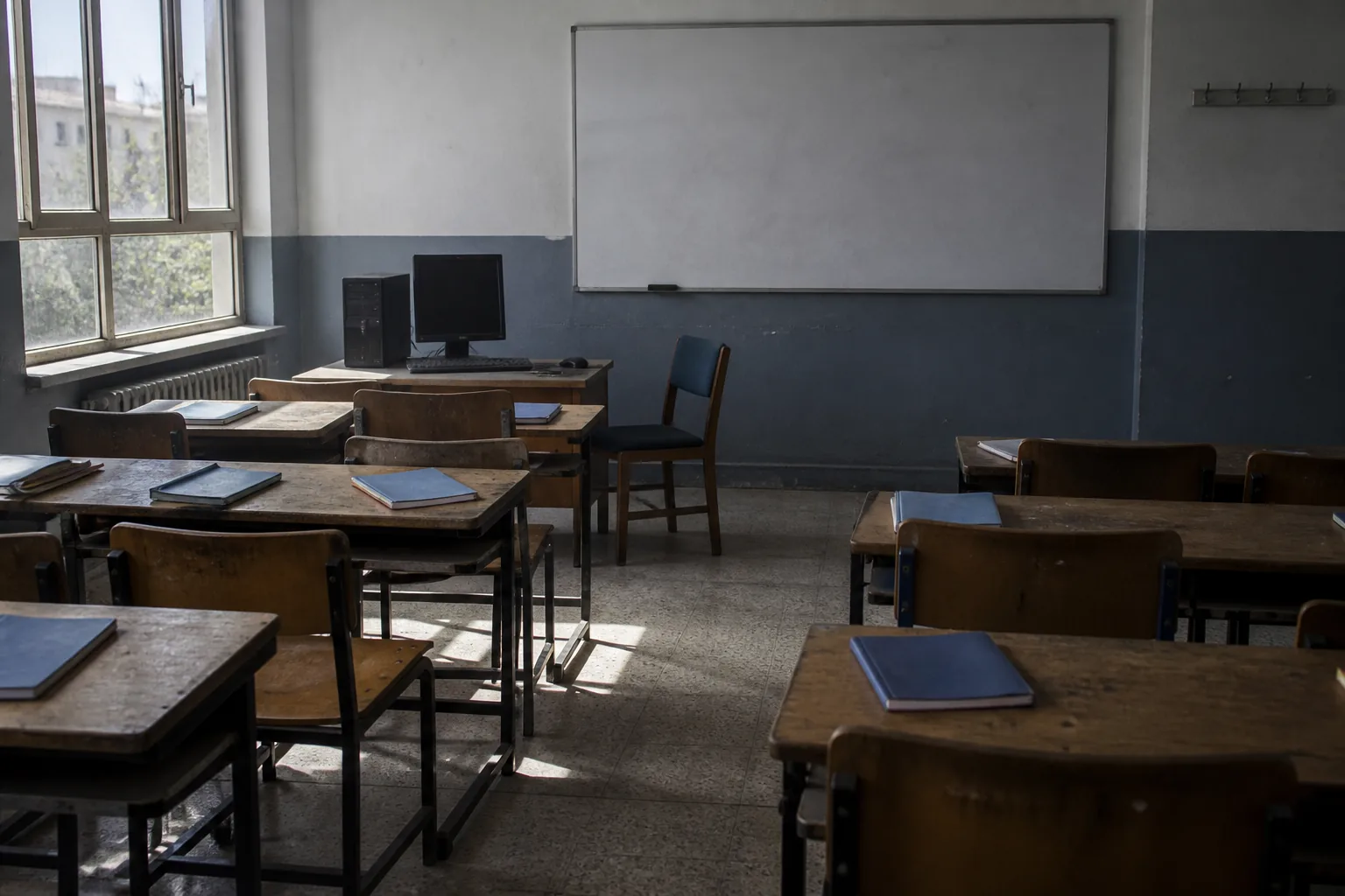 An empty university classroom during the temporary suspension