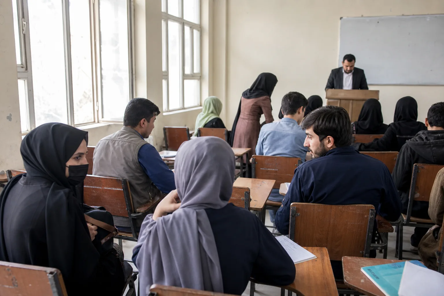 Students returning to a university classroom in 2023
